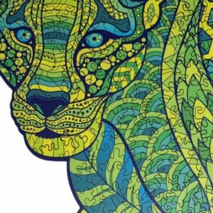 Close-up of face of big cat leopard shaped jigsaw puzzle with yellow, green and blue patterns